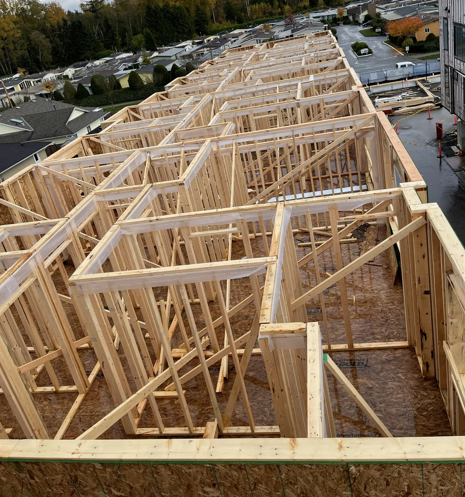 Row of framed townhouse units viewed from above