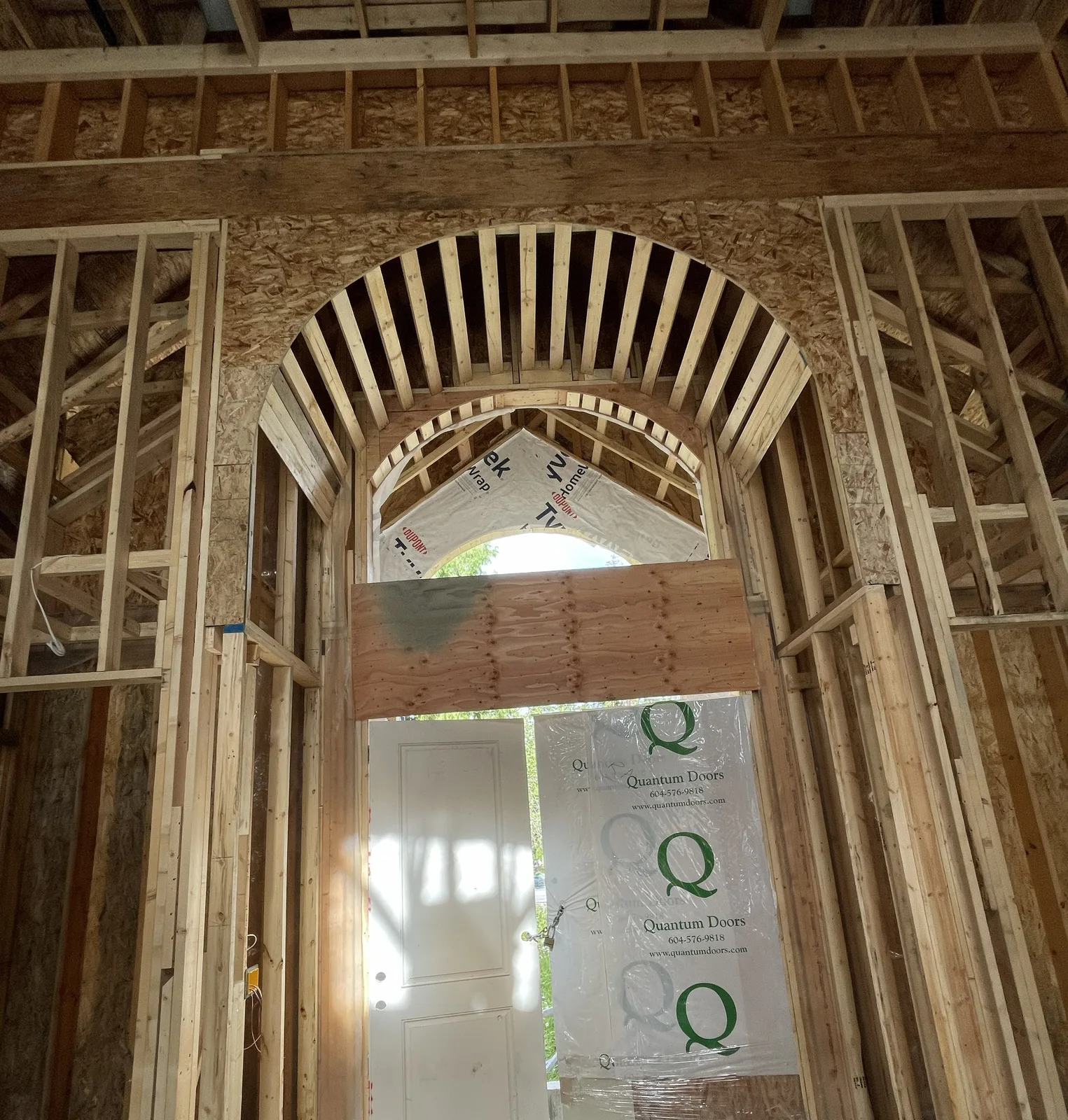 Custom curved wood framing around an arched opening