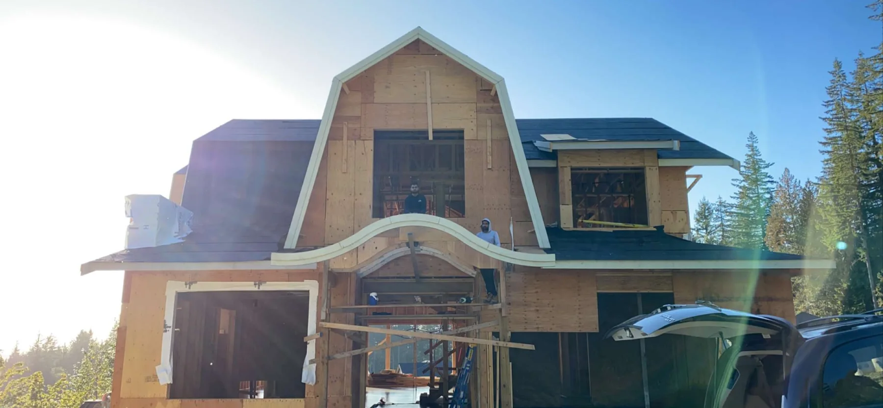 Curved architectural roof framing detail on a custom home