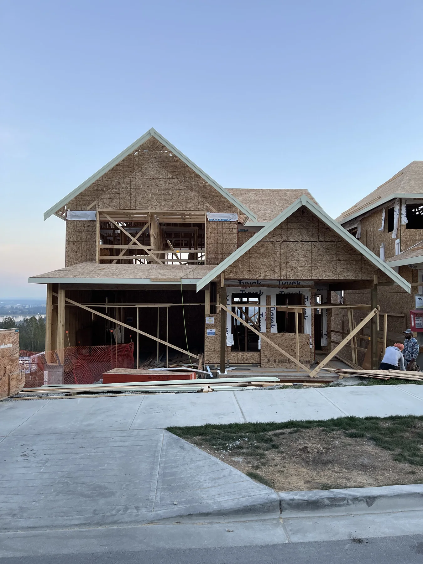 Custom home with multiple gable rooflines framed in BC